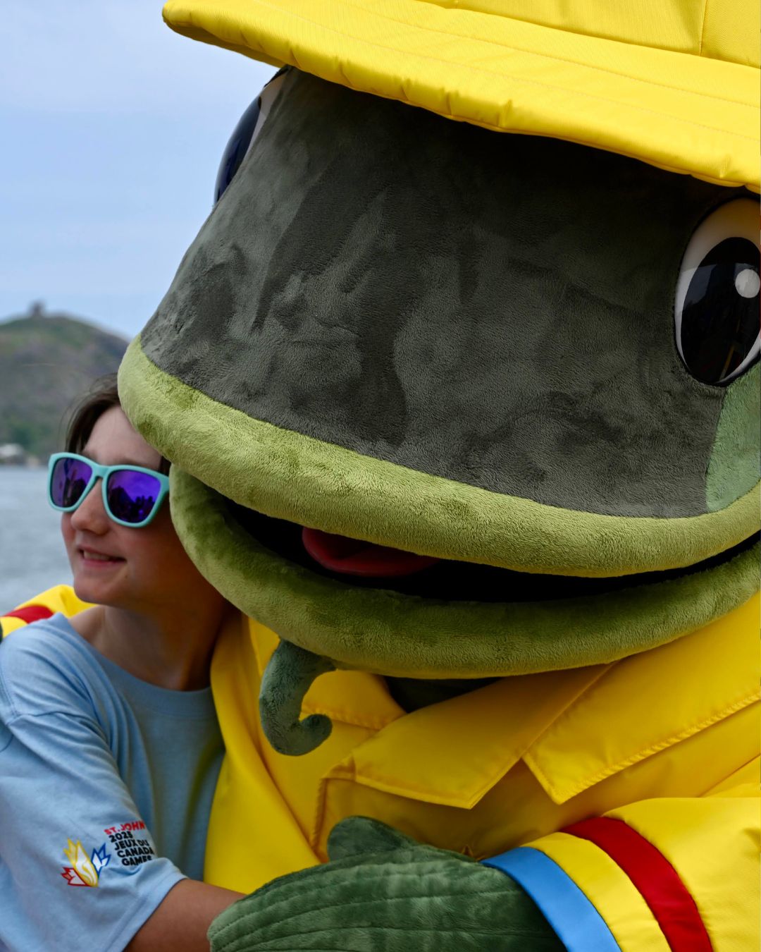 2025 Canada Summer Games mascot Gusty poses with his creator
